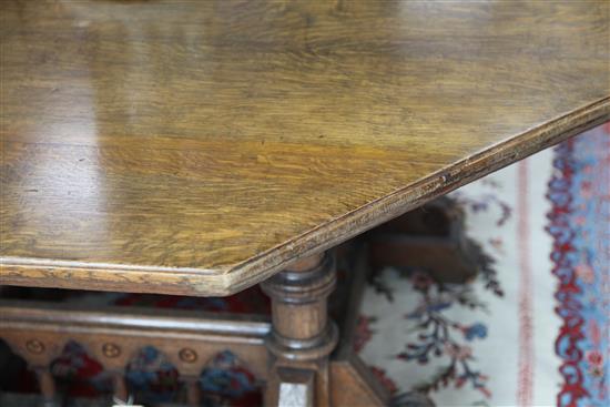 A Victorian gothic revival oak centre table, designed by Collier & Plucknett, Warwick, W.5ft D.5ft H.2ft 7in.